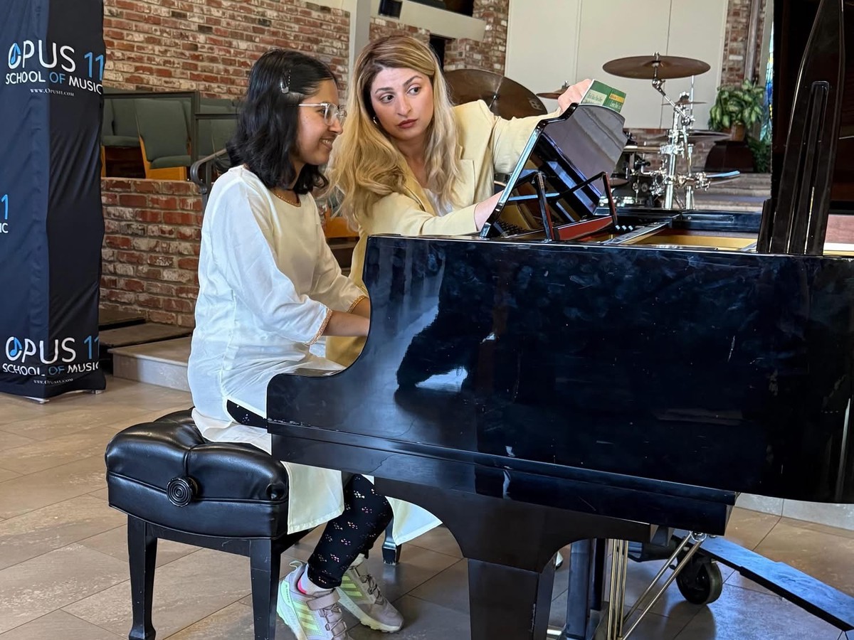Instructor and student in a WunderJam adaptive piano lesson at Opus11